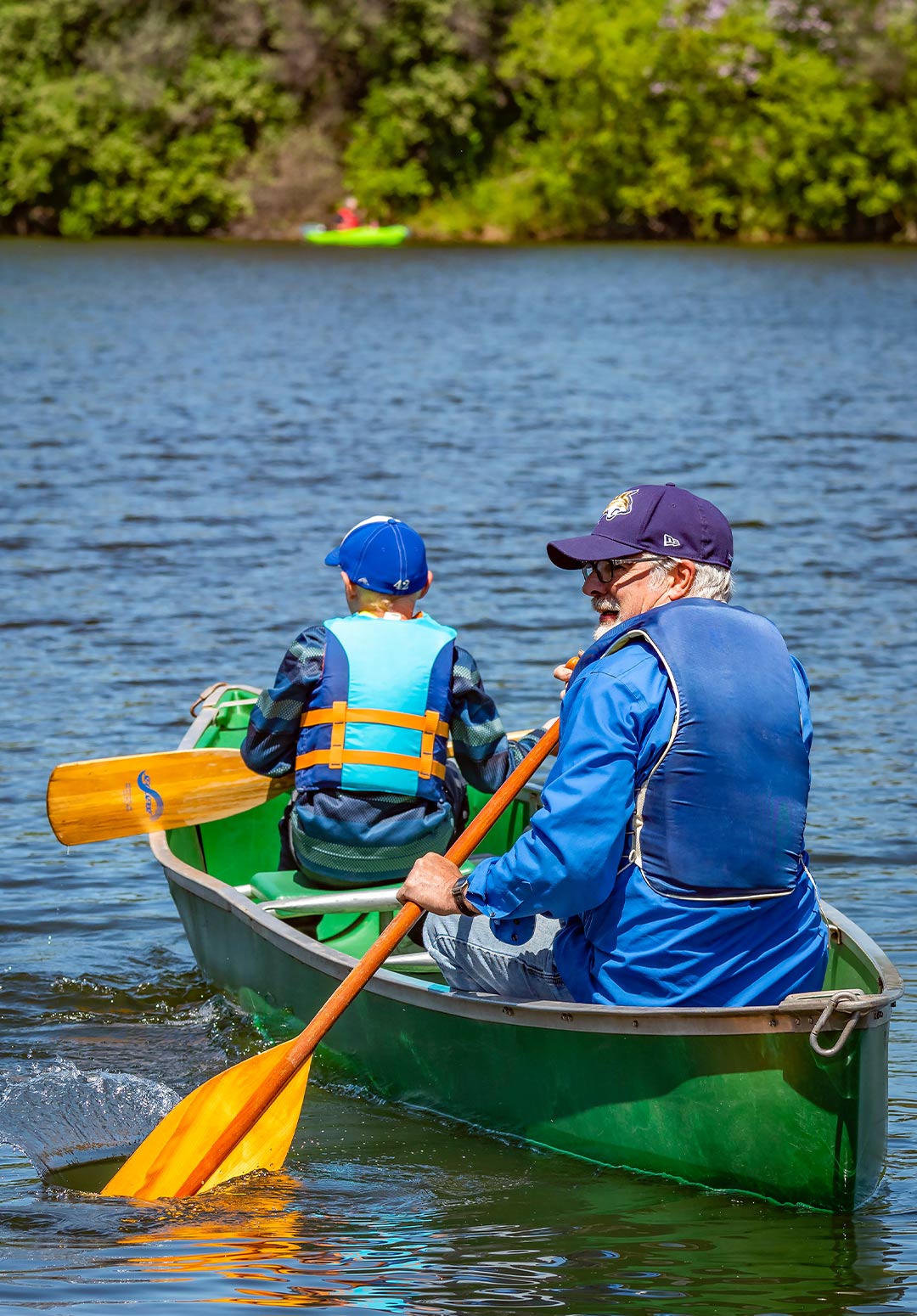 Old man and young boy canoeing