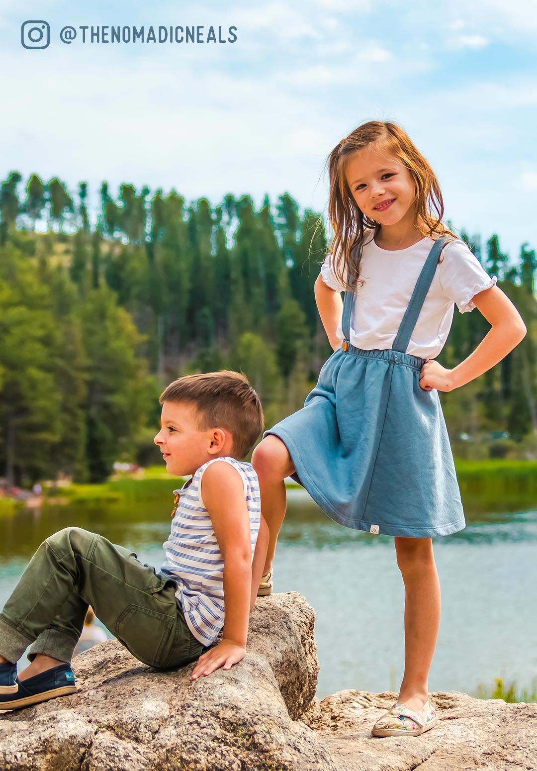 young boy and girl posing on a rock